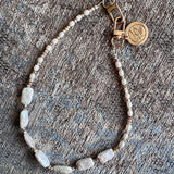 One, of one: Pearl phone bracelet